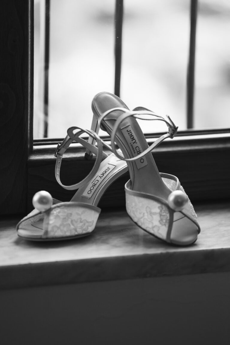 black and white photo of wedding high heel shoes