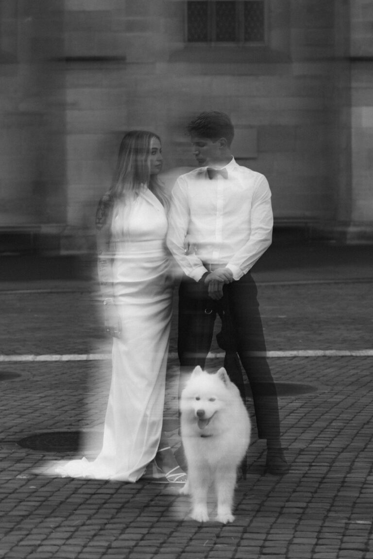 aesthetic blurry black and white photo of couple and a dog